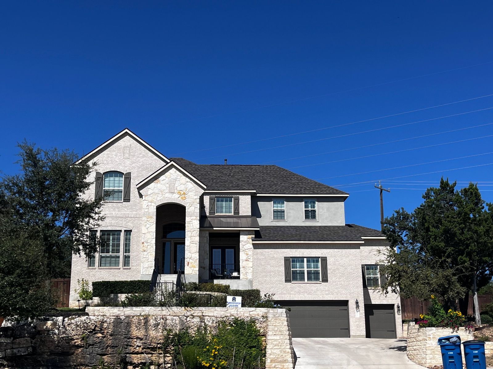 Finished roof on a stone and brick home
